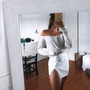 Off the shoulder pale blue sweater with cross back